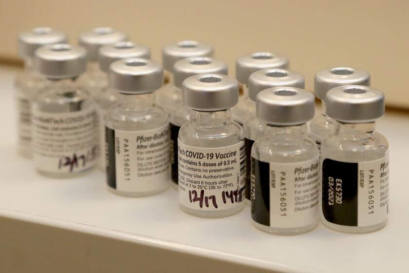 Empty vials of Pfizer-BioNTech COVID-19 vaccine.