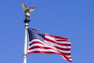 The United States flag flies at the top of Union Station, Wednesday, March 8, 2023, in Washington. (AP Photo/Mariam Zuhaib)