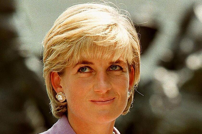 (FILES) This file photo taken on June 17, 1997 shows Britain's Diana, Princess of Wales (L), at a ceremony at Red Cross headquarters in Washington, to call for a global ban on anti-personnel landmines. Two decades on from the death of princess Diana, her sons Princes William and Harry are working to keep her legacy alive with unusually emotional tributes after years of official silence. William was 15 and Harry 12 when Diana died in a car crash in Paris on August 31, 1997. / AFP PHOTO / JAMAL A. WILSONJAMAL A. WILSON/AFP/Getty Images ** OUTS - ELSENT, FPG, CM - OUTS * NM, PH, VA if sourced by CT, LA or MoD **