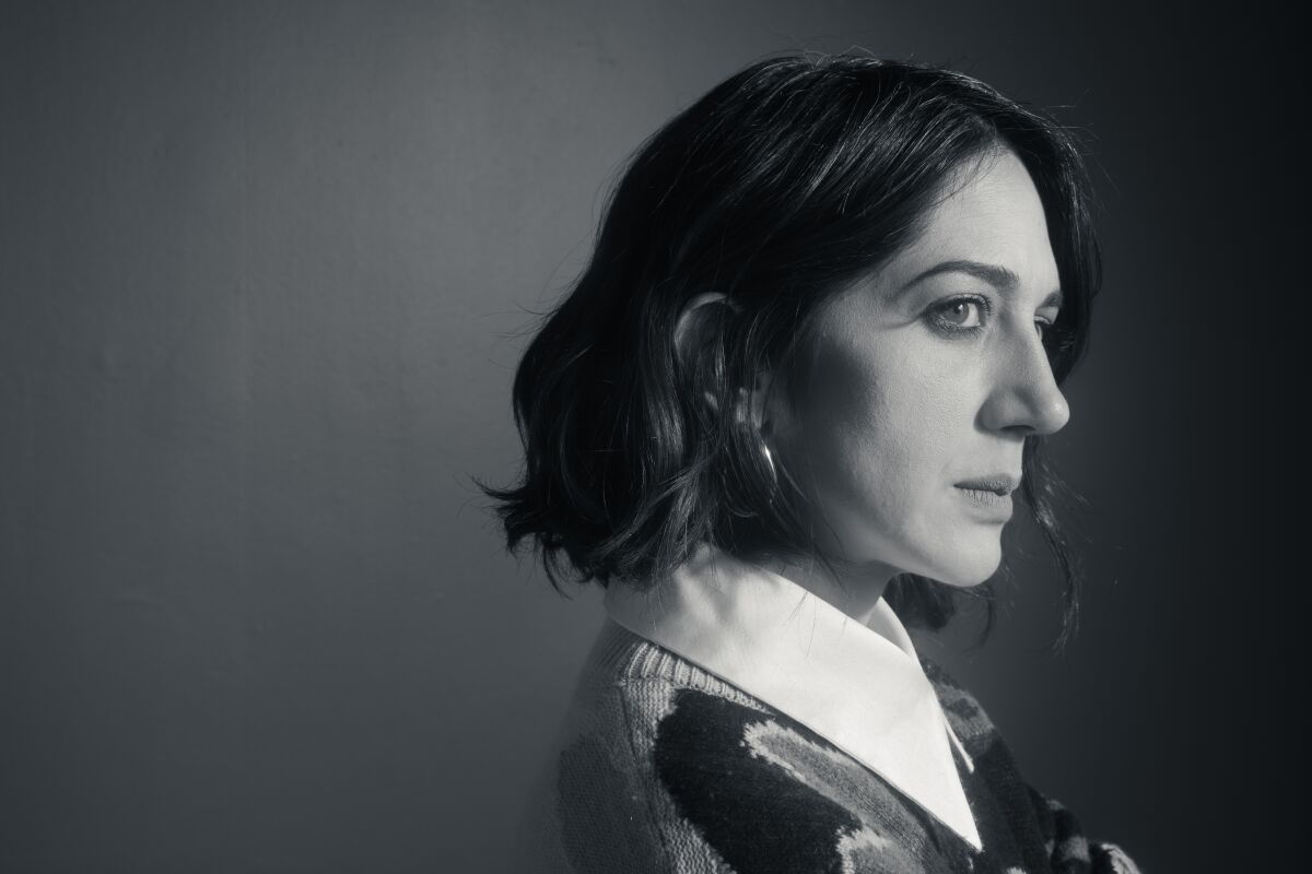 A wooman photographed in profile in black and white
