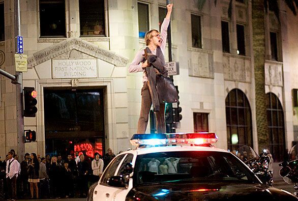 A protester atop a police car at Hollywood Boulevard and Highland Avenue in Hollywood shouts against the passage of Proposition 8.