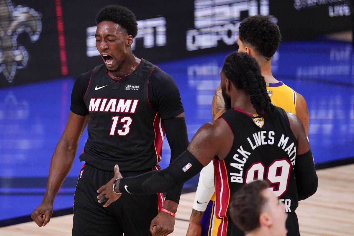 Miami Heat forward Bam Adebayo celebrates after scoring against the Los Angeles Lakers during the first half in Game 4 of basketball's NBA Finals Tuesday, Oct. 6, 2020, in Lake Buena Vista, Fla. (AP Photo/Mark J. Terrill)