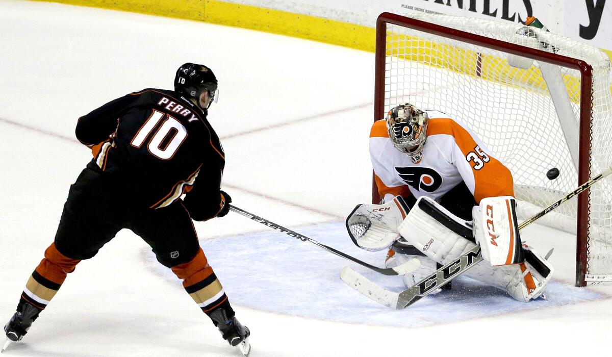 Ducks right wing Corey Perry scores against Flyers goalie Steve Mason during the shootout Wednesday night in Anaheim.