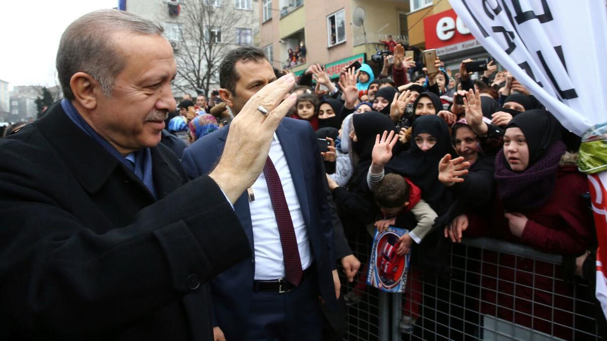 Turkish President Recep Tayyip Erdogan waves to his supporters March 11 in Istanbul.