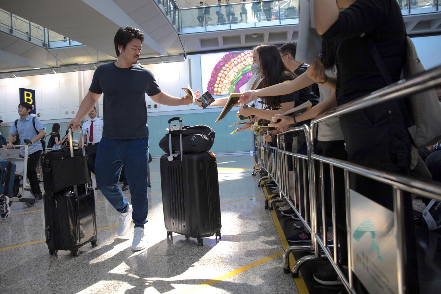 Anti-government protesters rally at Hong Kong airport