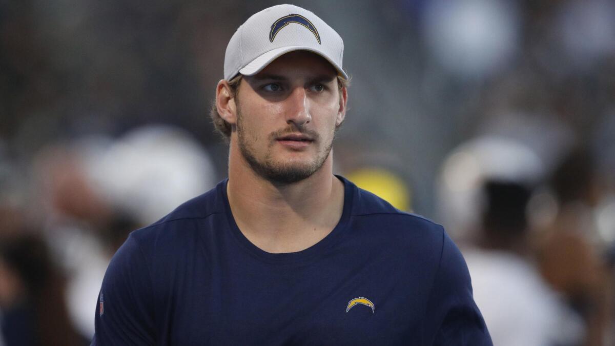 Chargers defensive end Joey Bosa looks on from the sideline during the second half against the New Orleans Saints on Aug. 25.