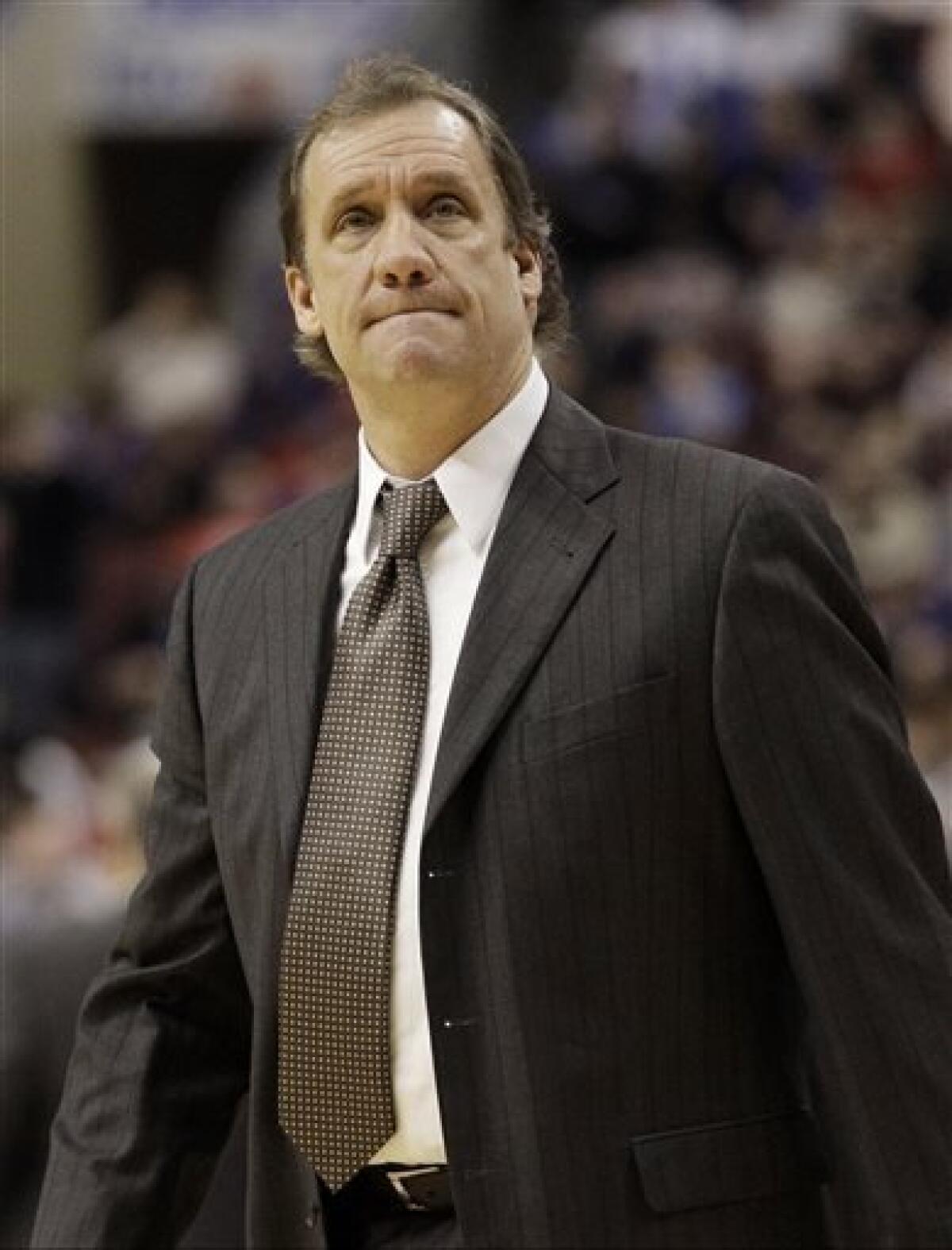 FILE - In this Jan. 13, 2012, file photo, then-Washington Wizards head coach Flip Saunders looks on during a break in an NBA basketball game against the Philadelphia 76ers in Philadelphia. David Kahn is out as president of basketball operations for the Minnesota Timberwolves and Flip Saunders is coming in. Three people with knowledge of the situation tell The Associated Press that team owner Glen Taylor has decided not to pick up the option for next season on Kahn's contract. He is also putting
