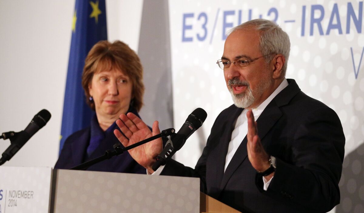 Former European foreign policy chief Catherine Ashton, left, and Iranian Foreign Minister Mohamad Javad Zarif, right, address the media after closed-door nuclear talks in Vienna, Austria on Monday.
