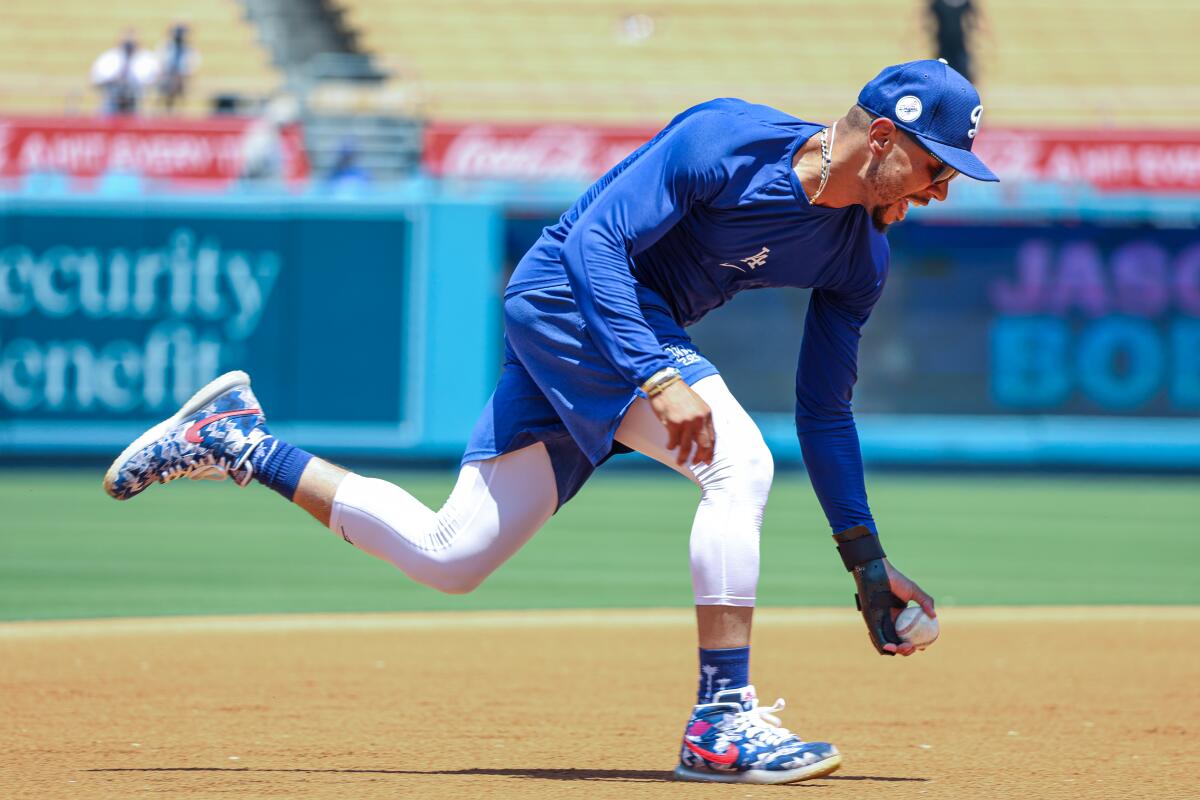 Mookie Betts goes through rehab drills before a game against the Milwaukee Brewers in July at Dodger Stadium.