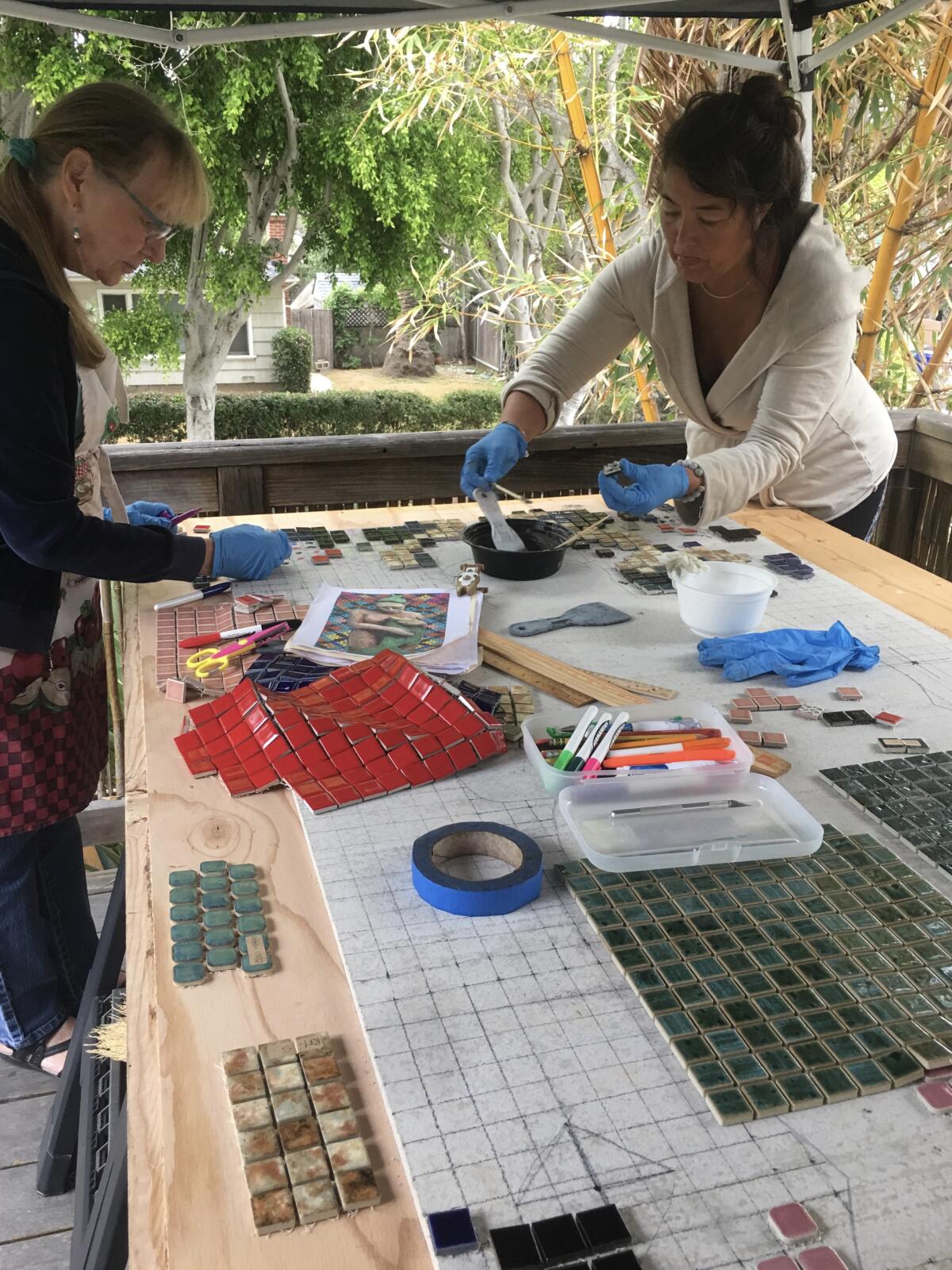 Cheryl Tall (left) completed "Oceanna" with her students.