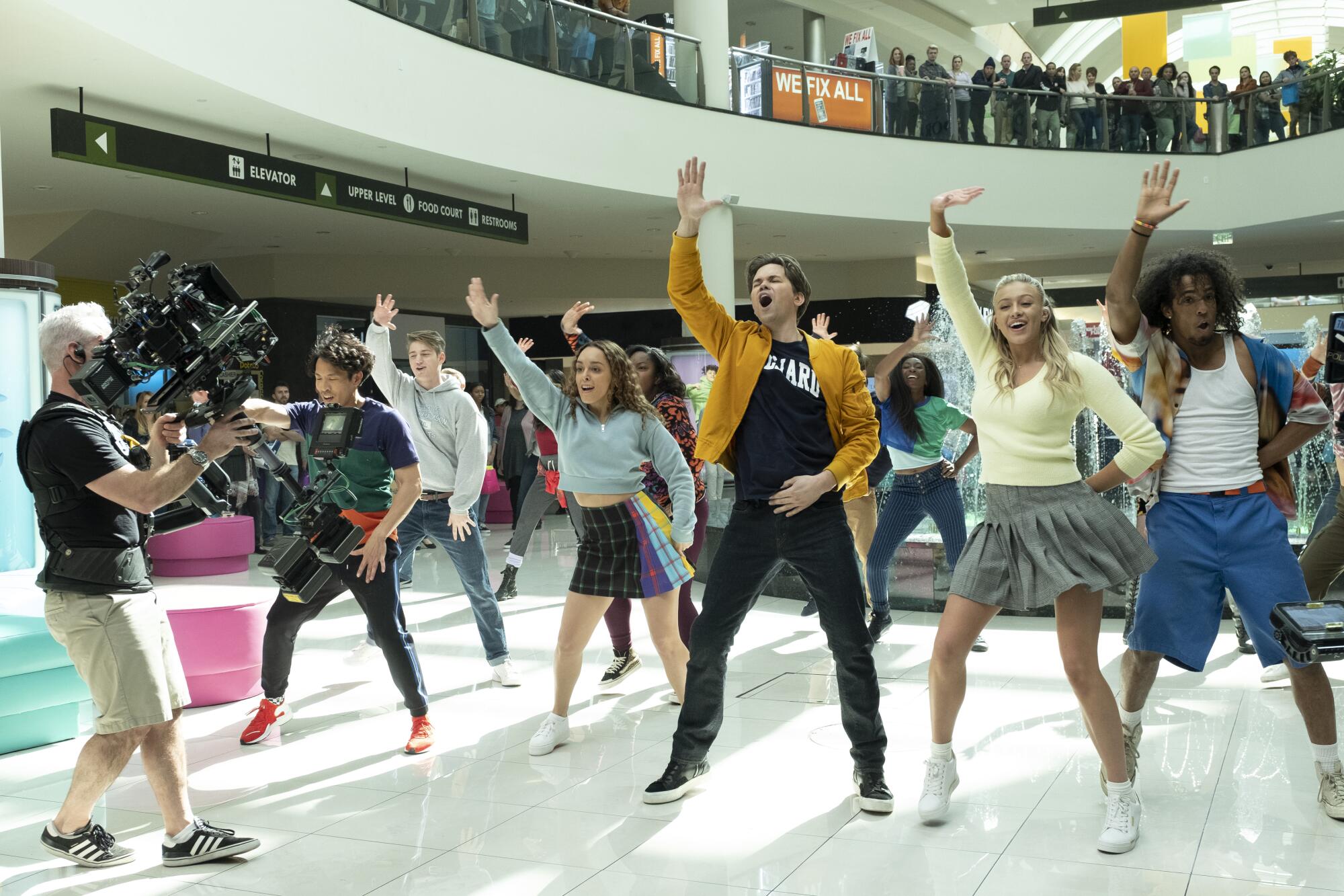 Andrew Rannells and fellow dancers perform "Love Thy Neighbor" in a mall courtyard for the Netflix movie "The Prom."
