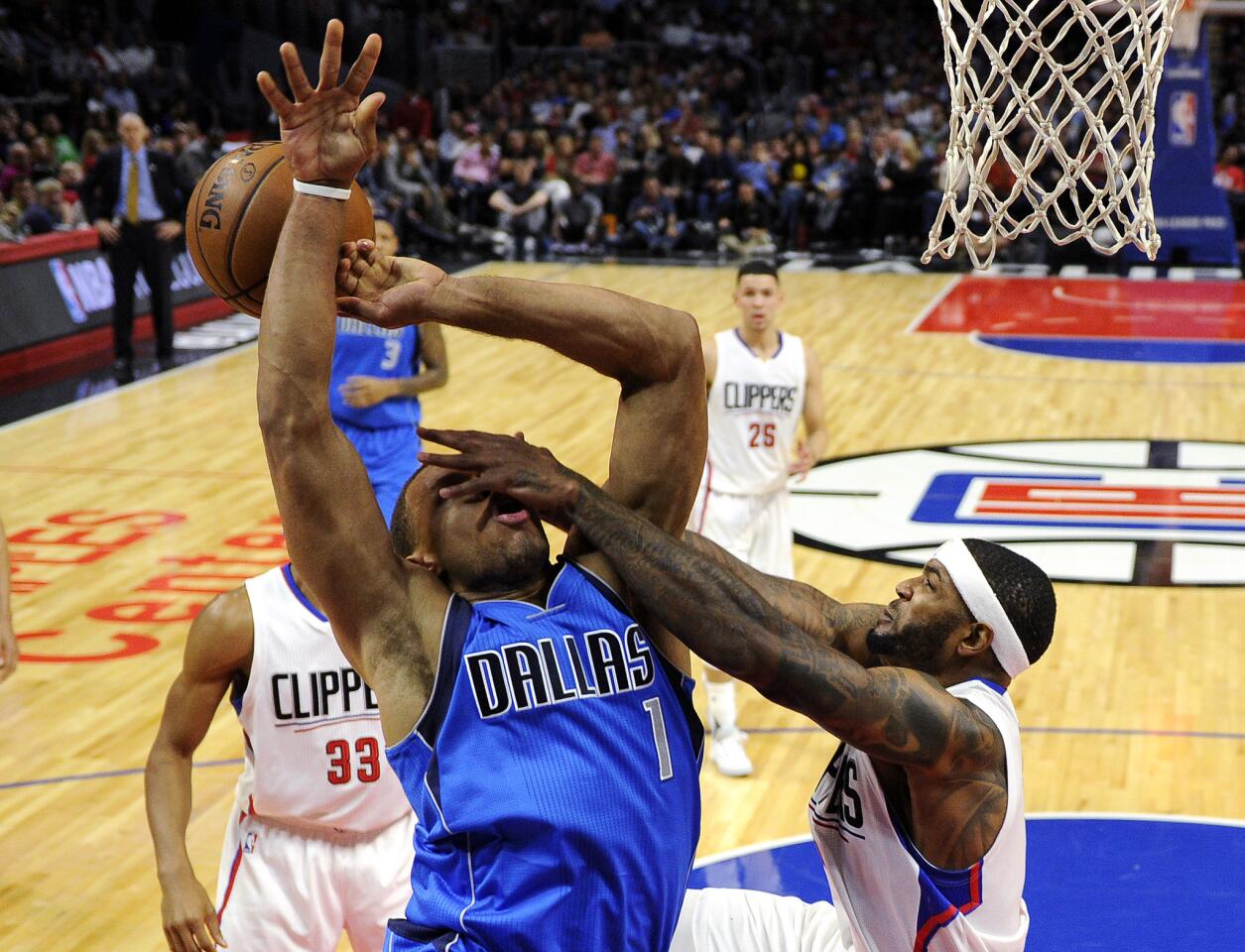 LOS ANGELES CA - OCTOBER 29: Justin Anderson #1 of the Dallas Mavericks is fouled by Josh Smith #5 of the Los Angeles Clippers during the fourth quarter of the basketball game at Staples Center October 29, 2015, in Los Angeles California. NOTE TO USER: User expressly acknowledges and agrees that, by downloading and or using this photograph, User is consenting to the terms and conditions of the Getty Images License Agreement. (Photo by Kevork Djansezian/Getty Images) ** OUTS - ELSENT, FPG, CM - OUTS * NM, PH, VA if sourced by CT, LA or MoD **