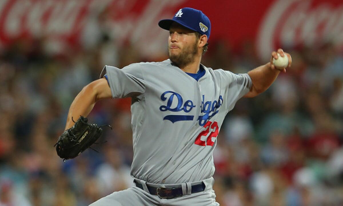 Dodgers starter Clayton Kershaw delivers a pitch during the team's 3-1 season-opening win over the Arizona Diamondbacks in Sydney, Australia, on Saturday.