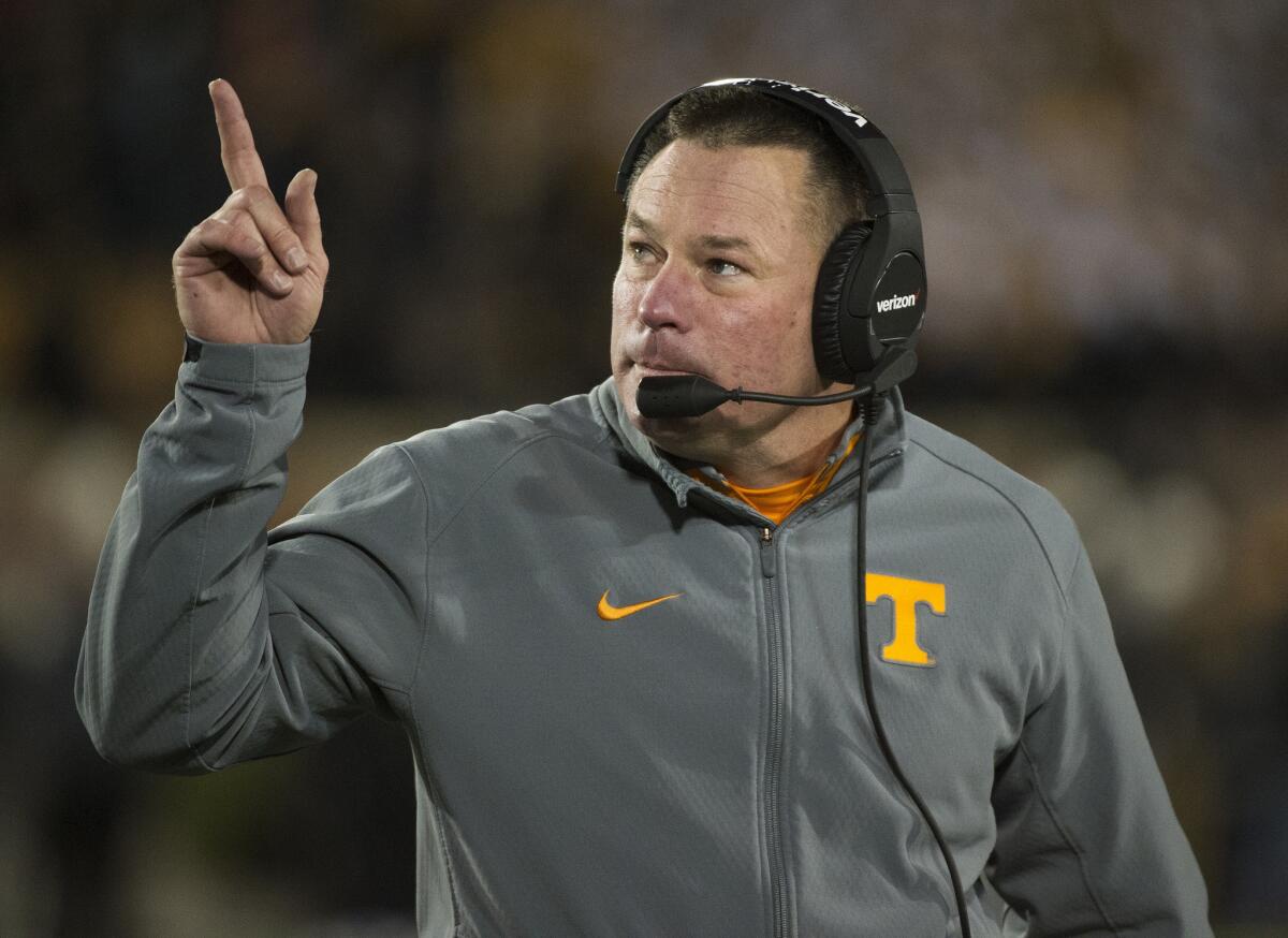 Tennessee Coach Butch Jones points to the scoreboard during a game against Missouri on Nov. 21.