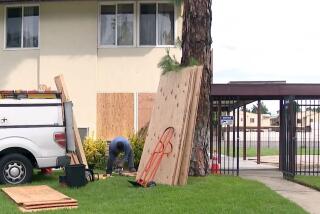 Windows are boarded up at Calvary Chapel Mid Valley Church after a person vandalized and broke into the church.