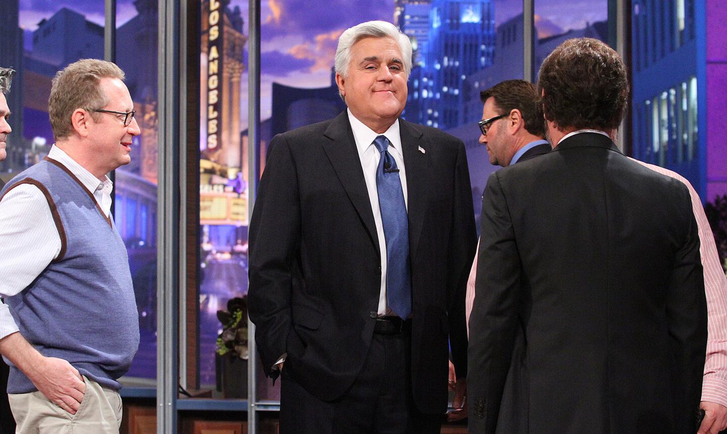 Jay Leno smiles for a moment during a commercial break standing at the center of a swirl of activity at the final recording of the Tonight Show with Jay Leno in Burbank at Burbank Studios on Thursday, February 6, 2014. Jay Leno ended a 22 year run as the host of the Tonight Show which now will be hosted by Jimmy Fallon.