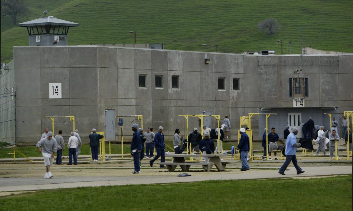 Inmates at an exercise yard at Solano State Prison in Vacaville in 2005. Gov. Jerry Brown proposes reducing California's use of private prisons as the inmate population drops.