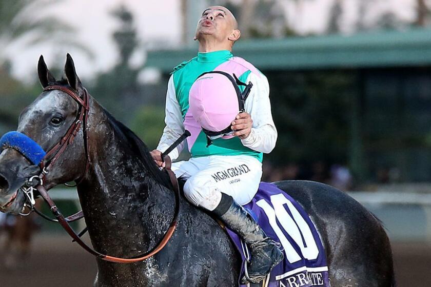 Jockey Mike Smith celebrates aboard Arrogate after winning the Breeders' Cup Classic at Santa Anita on Nov. 5.
