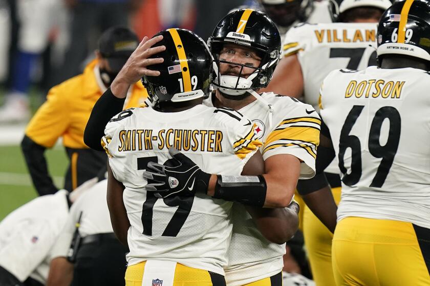 Pittsburgh Steelers wide receiver JuJu Smith-Schuster (19) celebrates with Pittsburgh Steelers quarterback Ben Roethlisberger (7) after scoring a touchdown against the New York Giants during the fourth quarter of an NFL football game Monday, Sept. 14, 2020, in East Rutherford, N.J. (AP Photo/Seth Wenig)