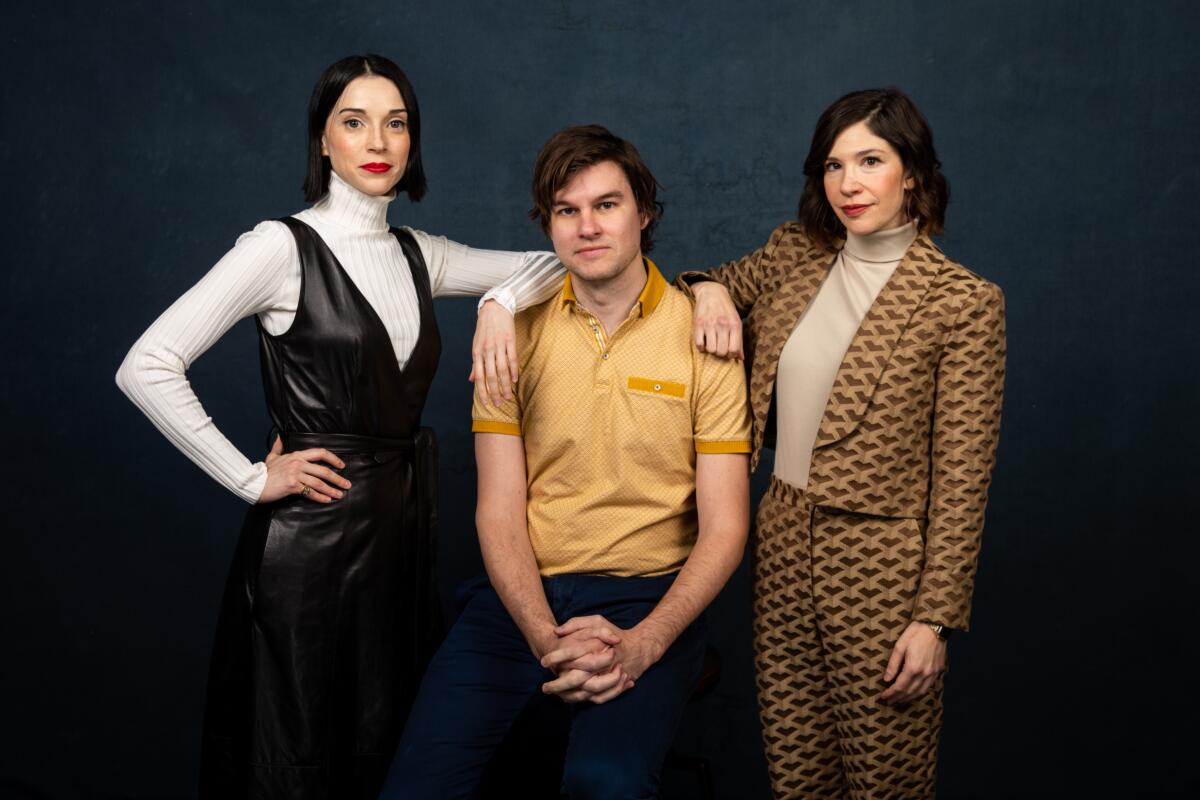 Annie Clark (a.k.a. St. Vincent), left,  director Bill Benz and Carrie Brownstein of “The Nowhere Inn,” photographed in the L.A. Times Studio at the Sundance Film Festival in Park City, Utah.