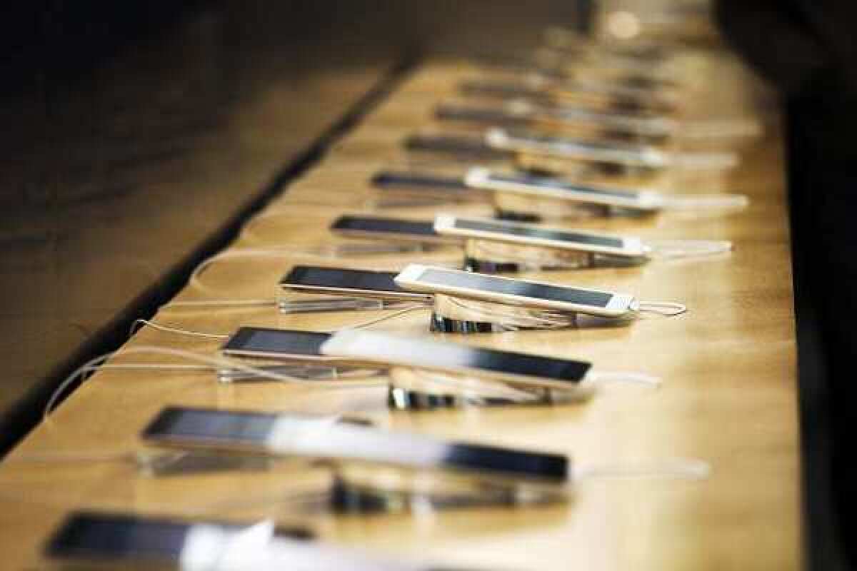 A row of new Apple iPads at an Apple store.