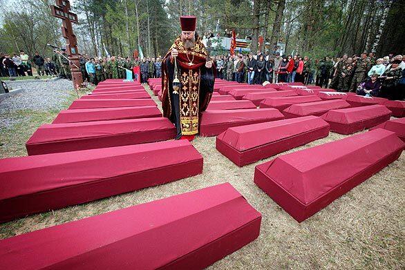 In the village of Sinyavino, 31 miles east of St. Petersburg, Russia, an Orthodox priest conducts a funeral for remains of Soviet soldiers killed during World War II. The remains of over 500 soldiers killed in heavy battles during World War II were buried on the eve of the Victory Day.