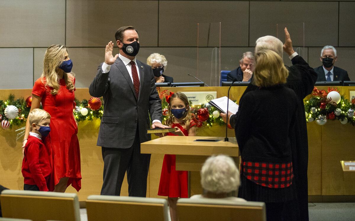 Senior U.S. District Court Judge Lawrence O'Neill, right, and his wife Kathleen administers the oath.