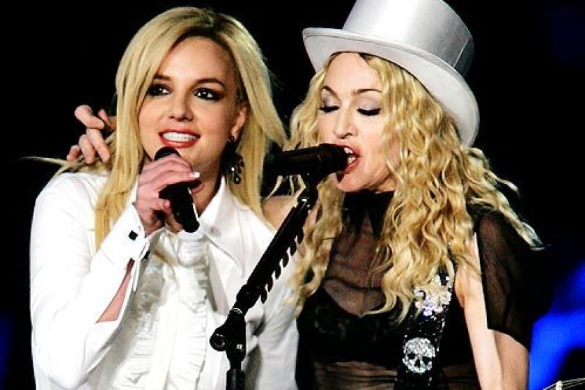 Madonna, with special guest singer Britney Spears, performs during her Sticky and Sweet Tour at Dodger Stadium. More photos >>>