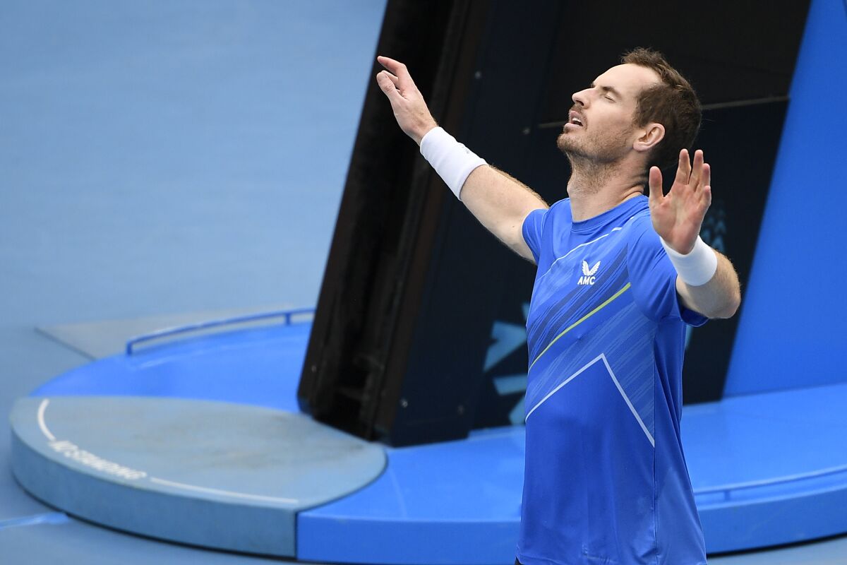 Andy Murray of Britain reacts after defeating Nikoloz Basilashvili of Georgia in their first round match at the Australian Open tennis championships in Melbourne, Australia, Tuesday, Jan. 18, 2022. (AP Photo/Andy Brownbill)