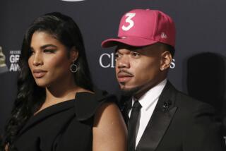 Kirsten Corley, left, and Chance the Rapper arrive at the Pre-Grammy Gala And Salute To Industry Icons at the Beverly Hilton Hotel on Saturday, Jan. 25, 2020, in Beverly Hills, Calif. (Photo by Mark Von Holden/Invision/AP)
