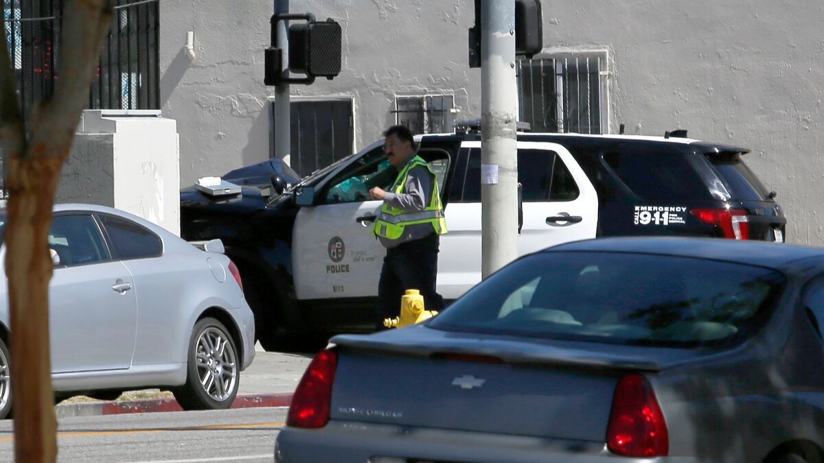 A police cruiser crashed near the intersection of 77th and San Pedro streets in Los Angeles,