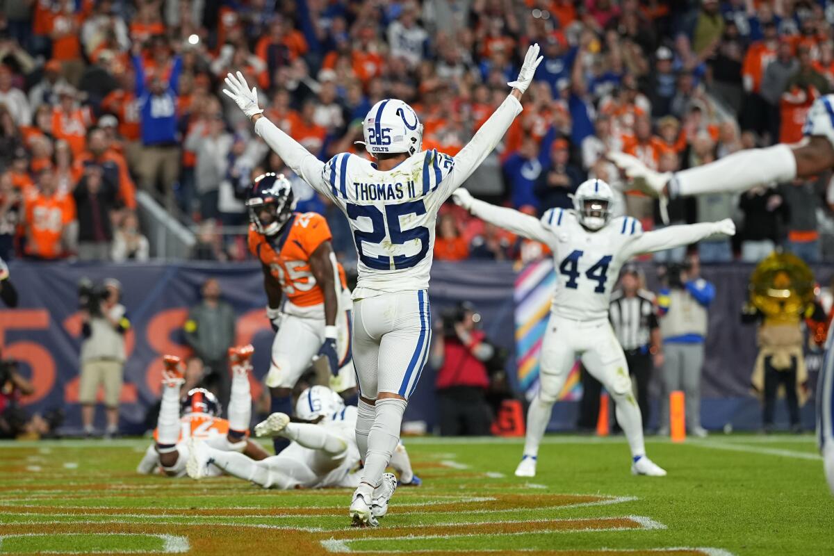 Indianapolis Colts safety Rodney Thomas II and linebacker Zaire Franklin celebrate after a game against the Denver Broncos.
