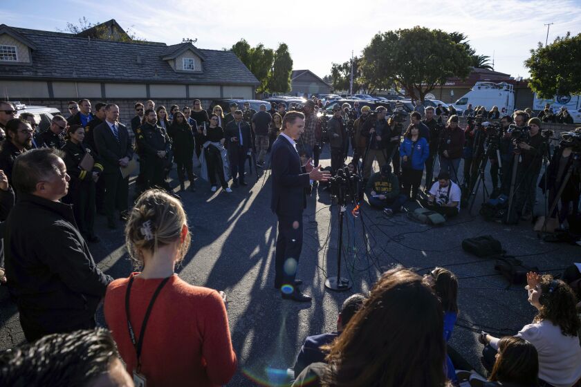 Gov. Gavin Newsom speaks to victims' families, local leaders and community members impacted by the fatal shootings a day earlier, at the I.D.E.S. Portuguese Hall in Half Moon Bay, Calif., Tuesday, Jan. 24, 2023. (AP Photo/ Aaron Kehoe)