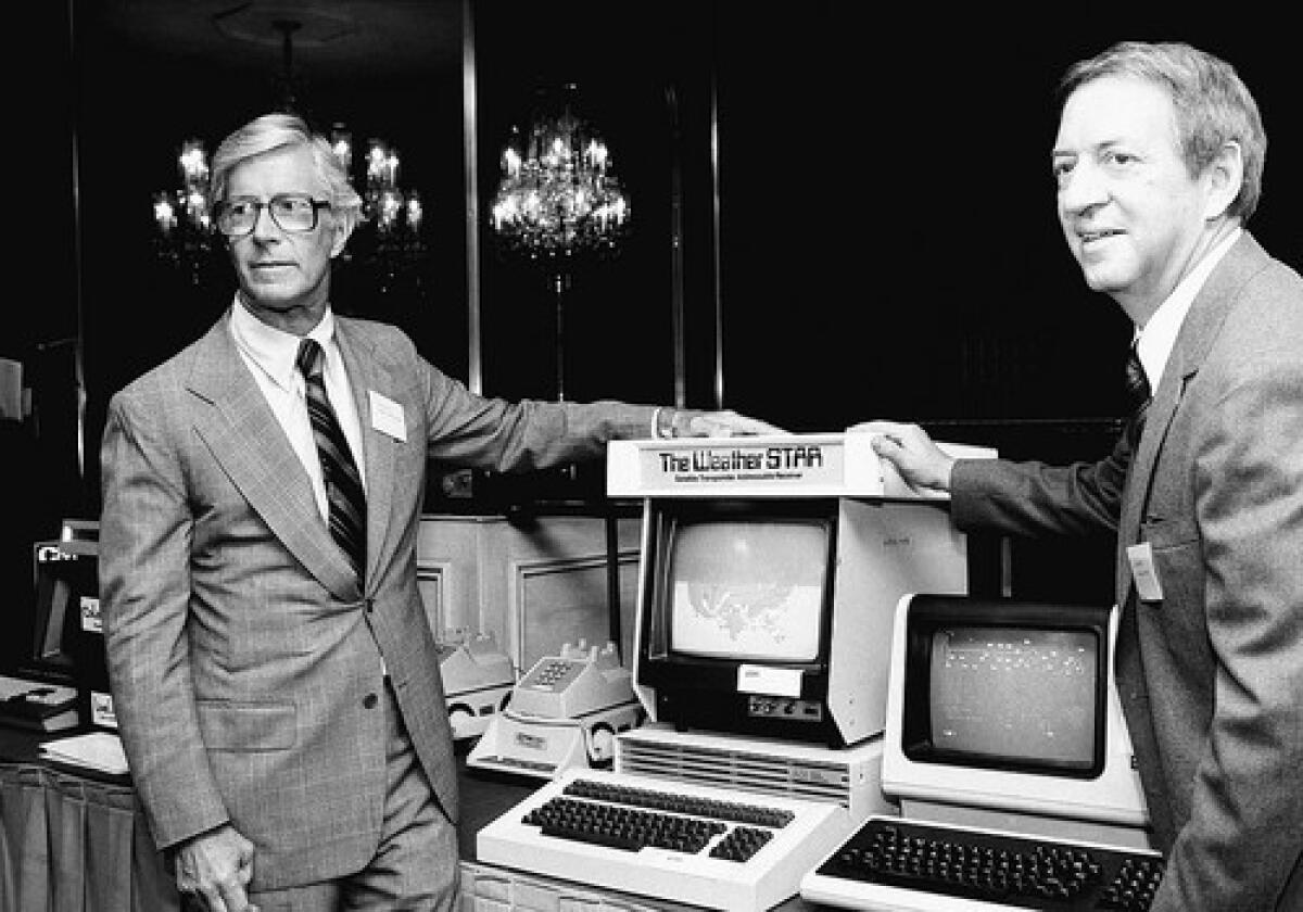 Frank Batten, left, introduces the Weather Channel with ABC-TV weatherman John Coleman. In 2008, Batten's firm sold the channel for $3.5 billion.