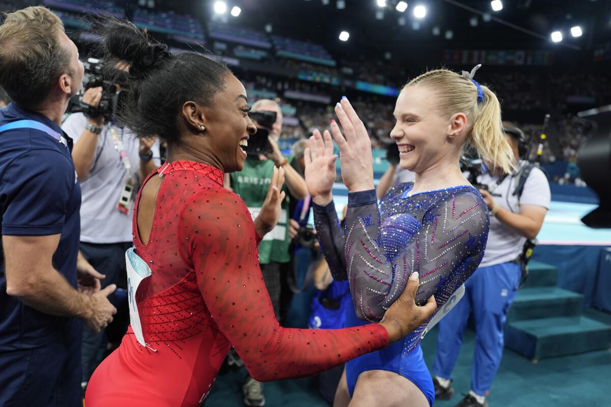 U.S. gymnast Simone Biles, left, celebrates with teammate Jade Carey.
