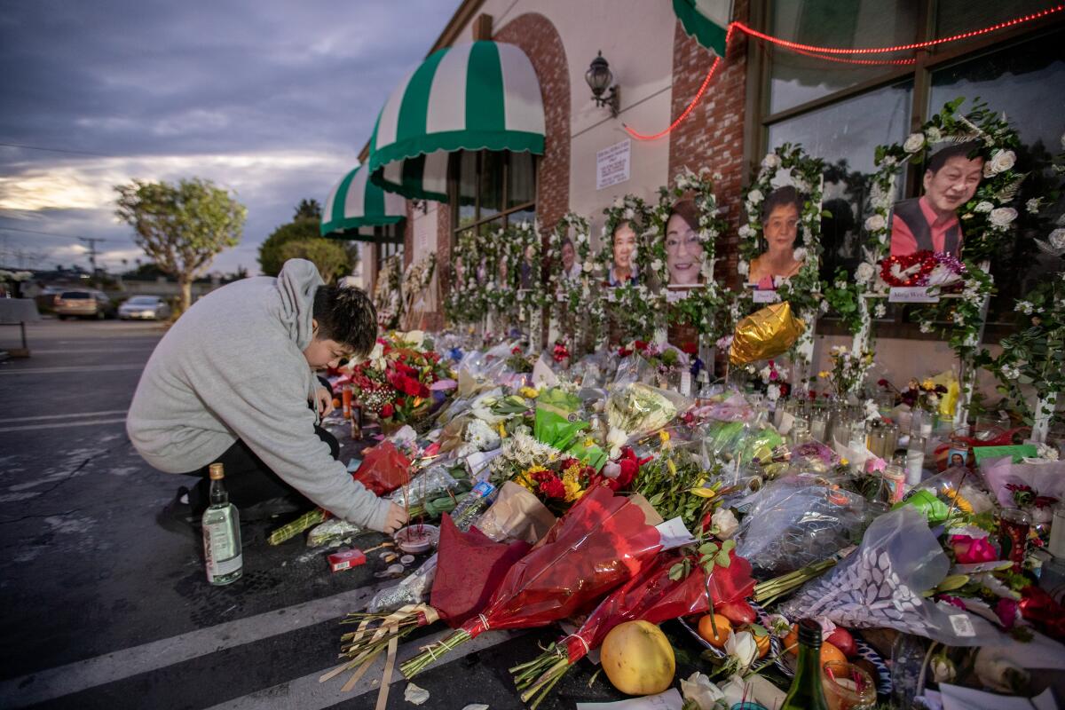 A woman at a memorial to shooting victims