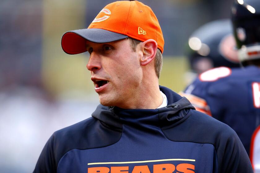 Adam Gase watches the Bears warm up before their final game of the season against Detroit on Jan. 3.