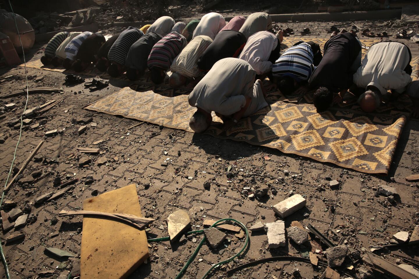 Praying amidst the rubble