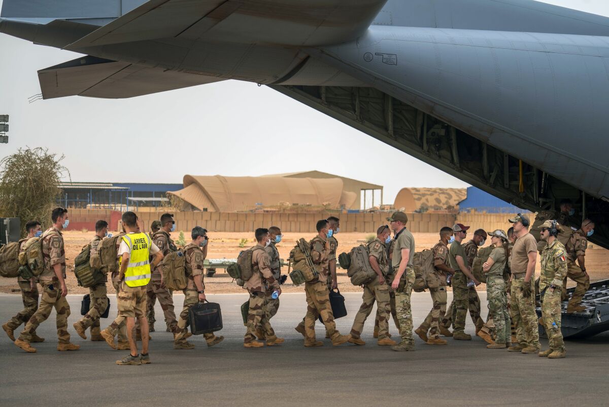 French soldiers boarding a transport plane