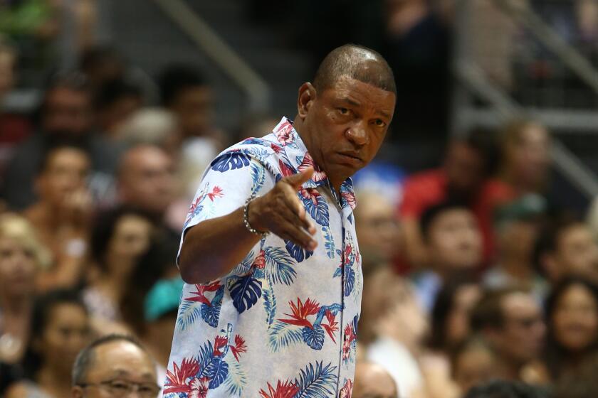 Clippers coach Doc Rivers gestures to his players during an exhibition game against the Sydney Kings on Sept. 30 in Honolulu.