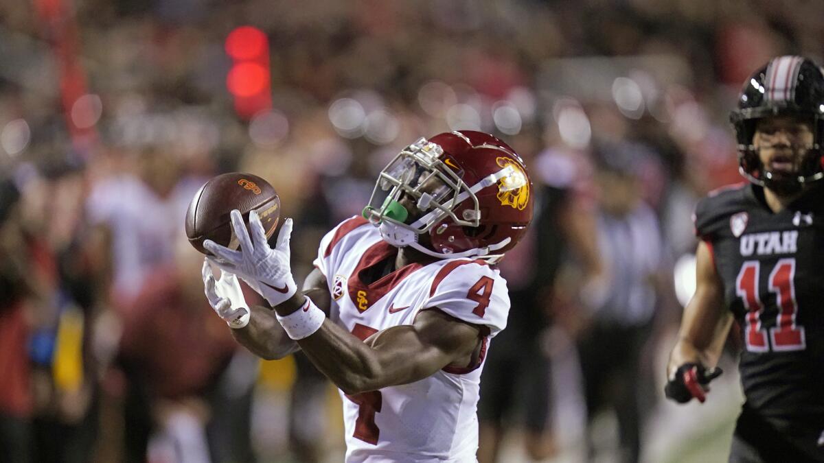 Trojans wide receiver Mario Williams catches a pass next to Utes safety R.J. Hubert (11) in the first half Oct. 15, 2022.