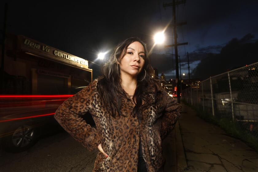 LOS ANGELES, CALIFORNIA--FEB. 14, 2019--Adult dancer Domino Rey, age 31, is organizing worker at Deja Vu and other strip clubs to unionize and oppose classifying its strippers as independent contractors rather than employees, thereby denying them the protections and benefits of labor laws. Rey once worked for Deja Vu Gentlemen's Club in downtown Los Angeles. (Carolyn Cole/Los Angeles Times)