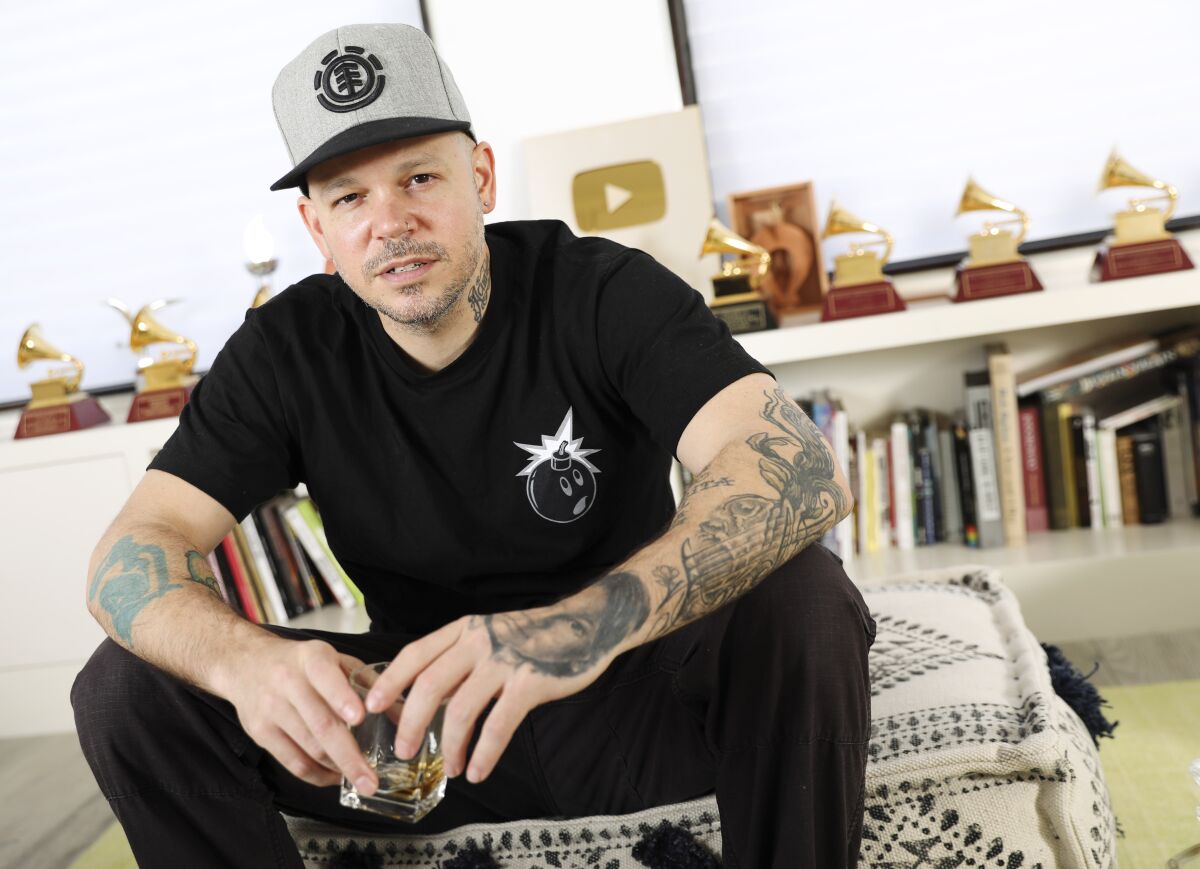 FILE - In this Friday, July 12, 2019 photo, rapper, writer, and filmmaker Rene Perez Joglar, know professionally as Residente, poses for a portrait in New York. Residente, the most decorated winner in the history of Latin Grammys, has signed a multi-year deal with Sony Music Entertainment to launch 1868 Studios. (Photo by Brian Ach/Invision/AP, File)