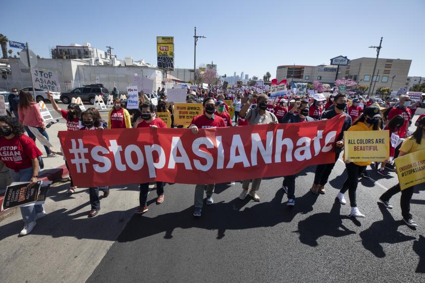 LOS ANGELES, CA - MARCH 27: Hundreds participated in a "Stop Asian Hate" rally in Koreatown on Saturday, March 27, 2021. (Myung J. Chun / Los Angeles Times)