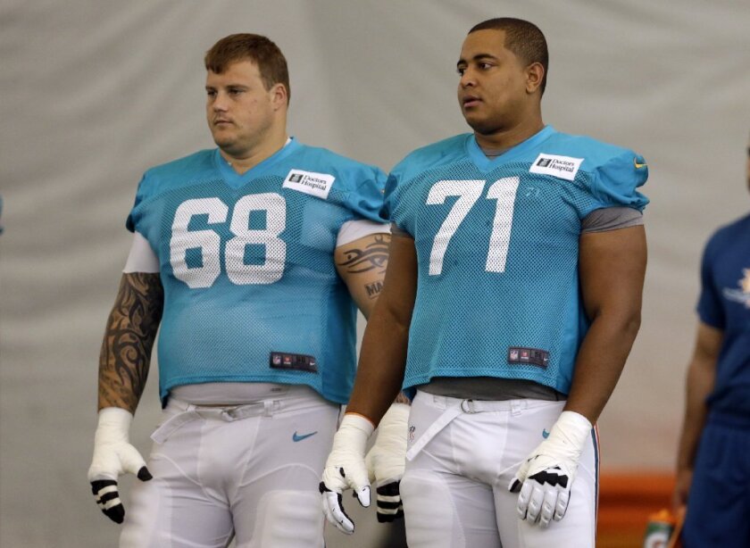 Miami Dolphins guard Richie Incognito (68) and tackle Jonathan Martin (71) during practice in Florida this summer.