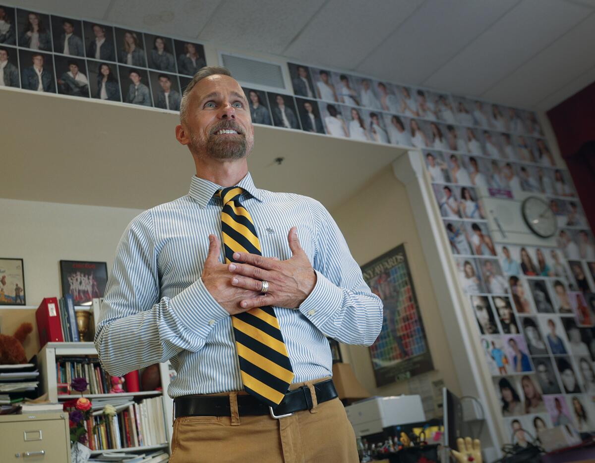 Burroughs High School drama teacher Guy Myers, with images of past drama student head shots on the wall, in his classroom on Monday. Myers is one of five California Teachers of the Year. The California Teacher of the Year representative was chosen by State Superintendent of Public Instruction Tony Thurmond.