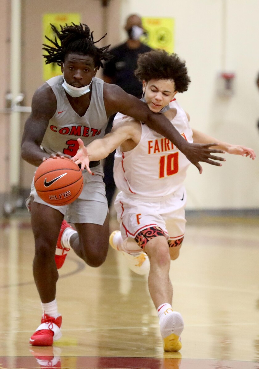 Westchester High School's #3 Zion Sutton drives down the court against Fairfax High School's #10 David Mack