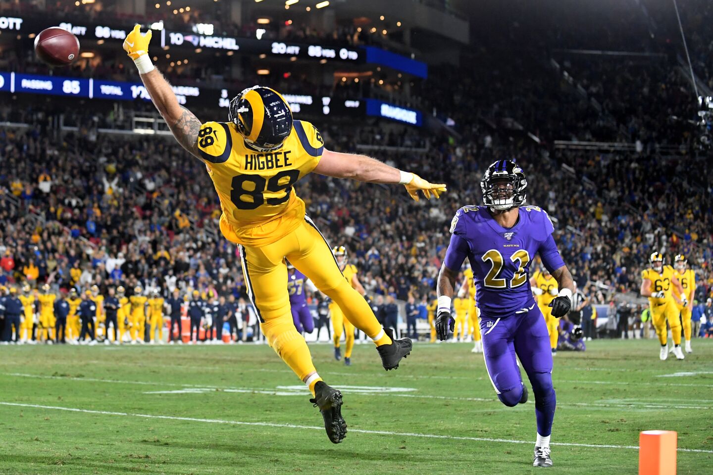 Rams tight end Tyler Higbee can't make the catch in the end zone in front of Ravens cornerback Jimmy Smith during the second quarter of a game Nov. 25 at the Coliseum.