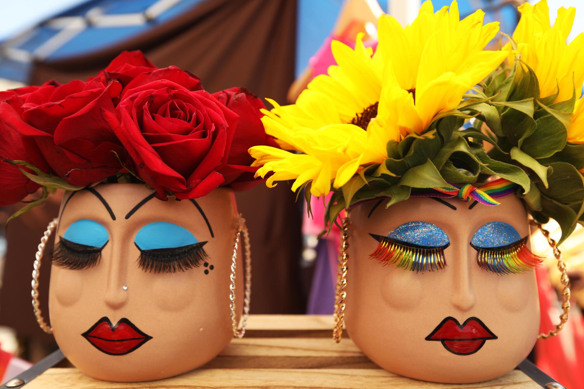 Two Cholita planters are for sale at the Queer Mercado.