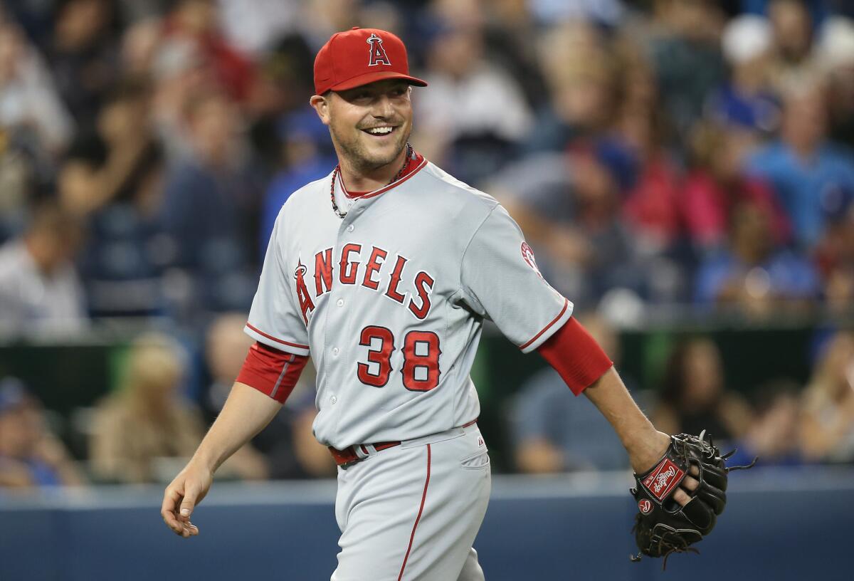 Angels reliever Joe Smith smiles after throwing a six-pitch inning against the Blue Jays on May 19 in Toronto.